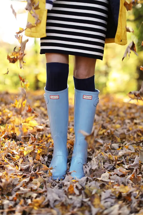 Striped dress with yellow jacket and rain boots