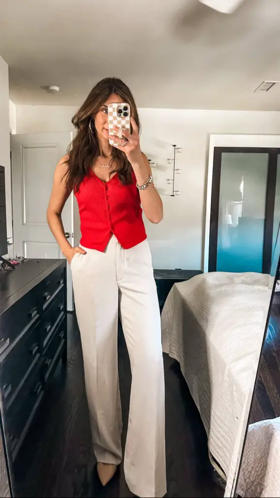 casual cream trousers outfit with red vest
